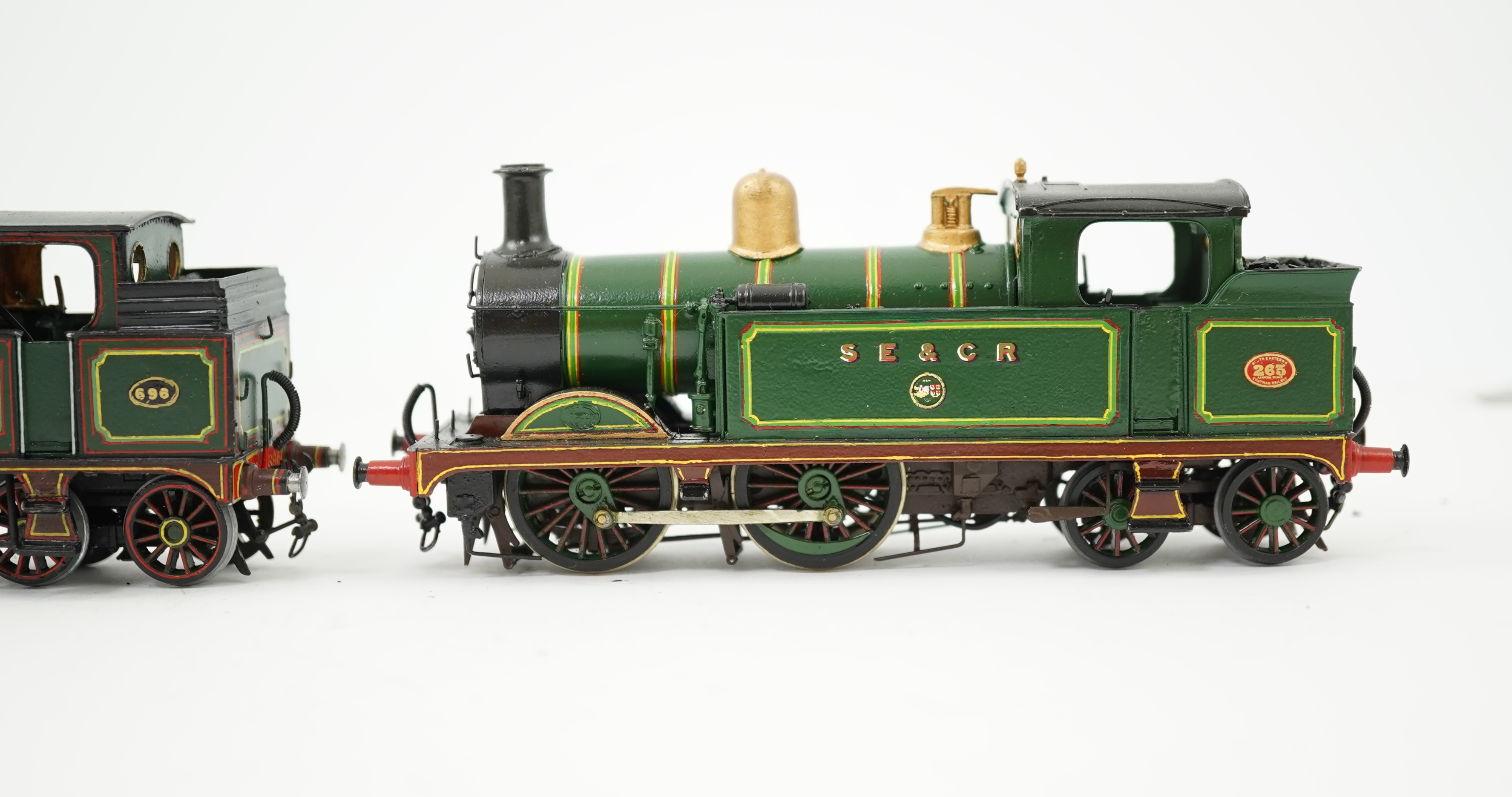 Three 00 gauge brass and white metal kit built Wainwright designed SE&CR tank locomotives (possibly by Wills Finecast); a class R1 0-4-4T, 696, a class H 0-4-4T, 263, and a class P 0-6-0T, 325, constructed, all painted a